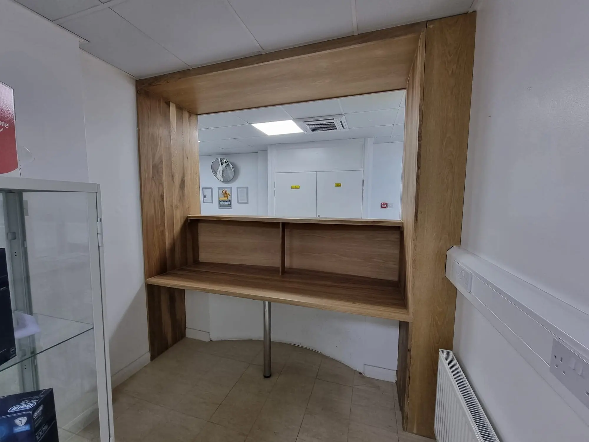 Oak-lined hatch opening with a timber shelf and counter